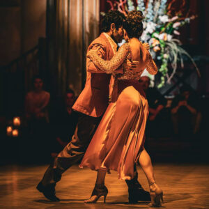Two Tango dancers on a ballroom floor